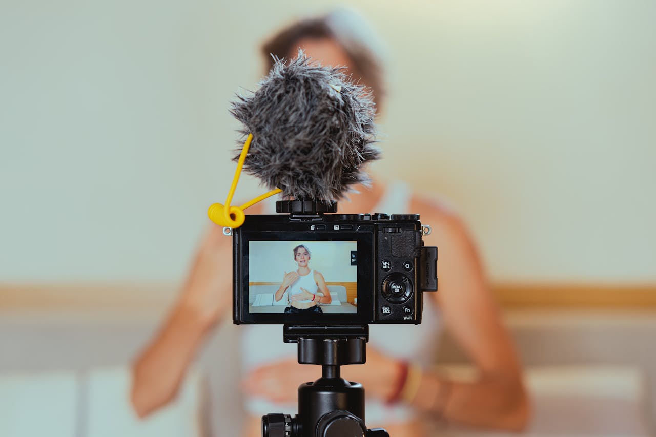 why-choose-us Elderly woman engages in vlogging using camera and microphone, embracing modern technology.